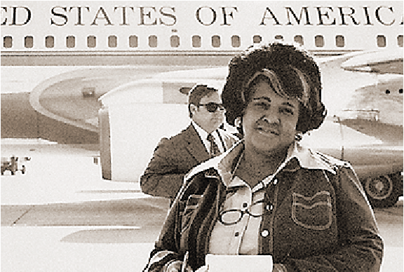 A photo of Ethel Payne next to Air Force One.