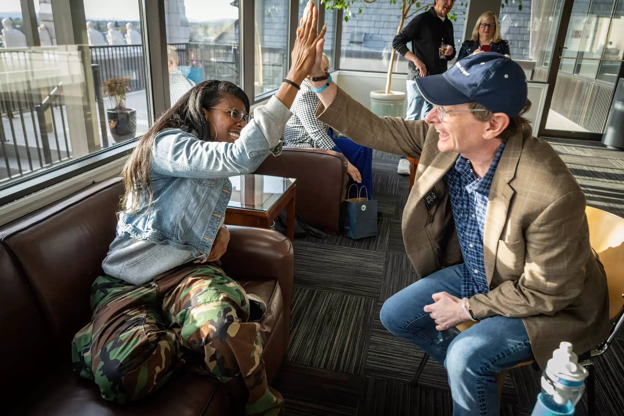 A photo of Rob Curley giving  high-five.