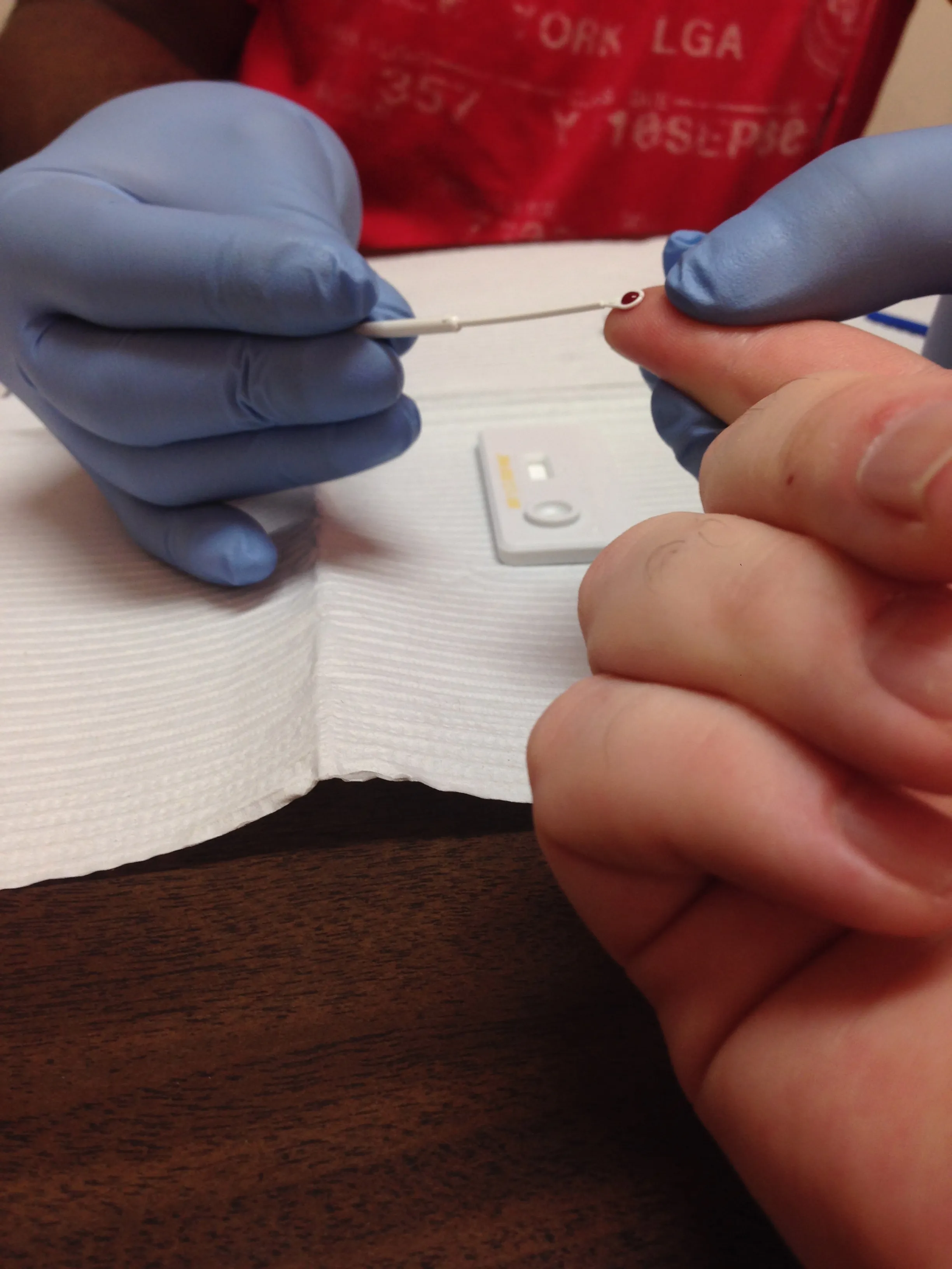A rapid test kit for HIV being adminstered at a clinic.