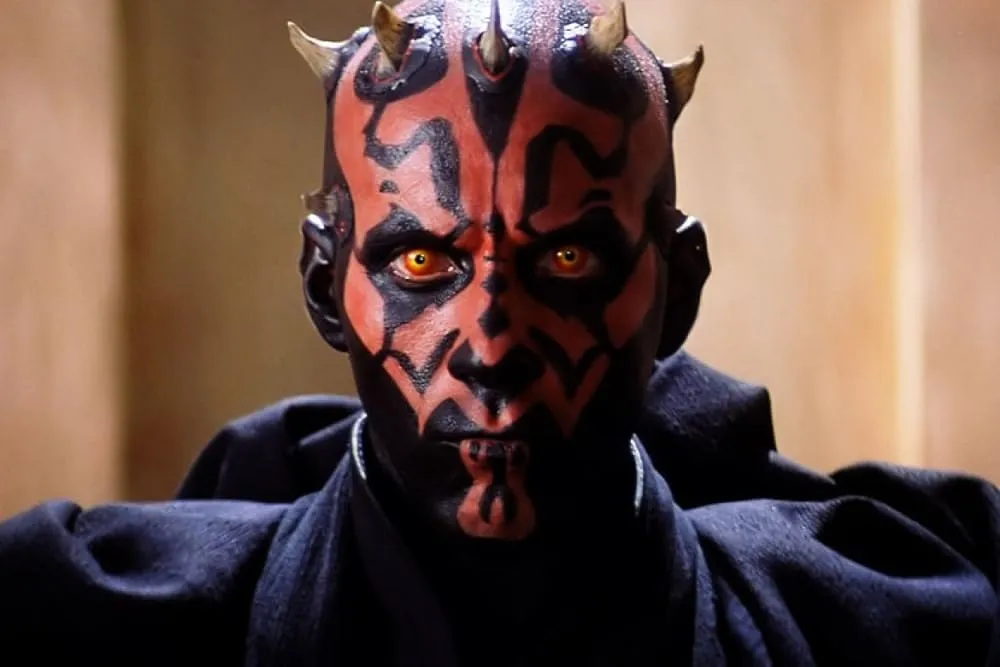 Darth Maul, played by Ray Park, shown on Naboo with his hood off right before he fights Qui-Gon Jinn and Obi-Wan Kenobi.