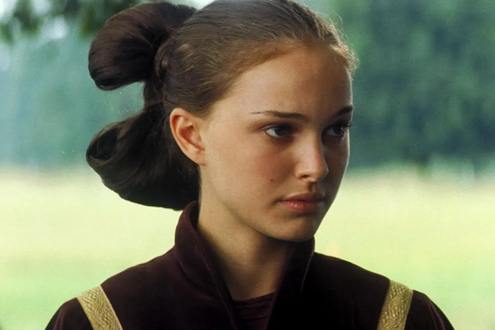 A close up of Queen Amidala, played by Natalie Portman. She is seen in this still on Naboo.