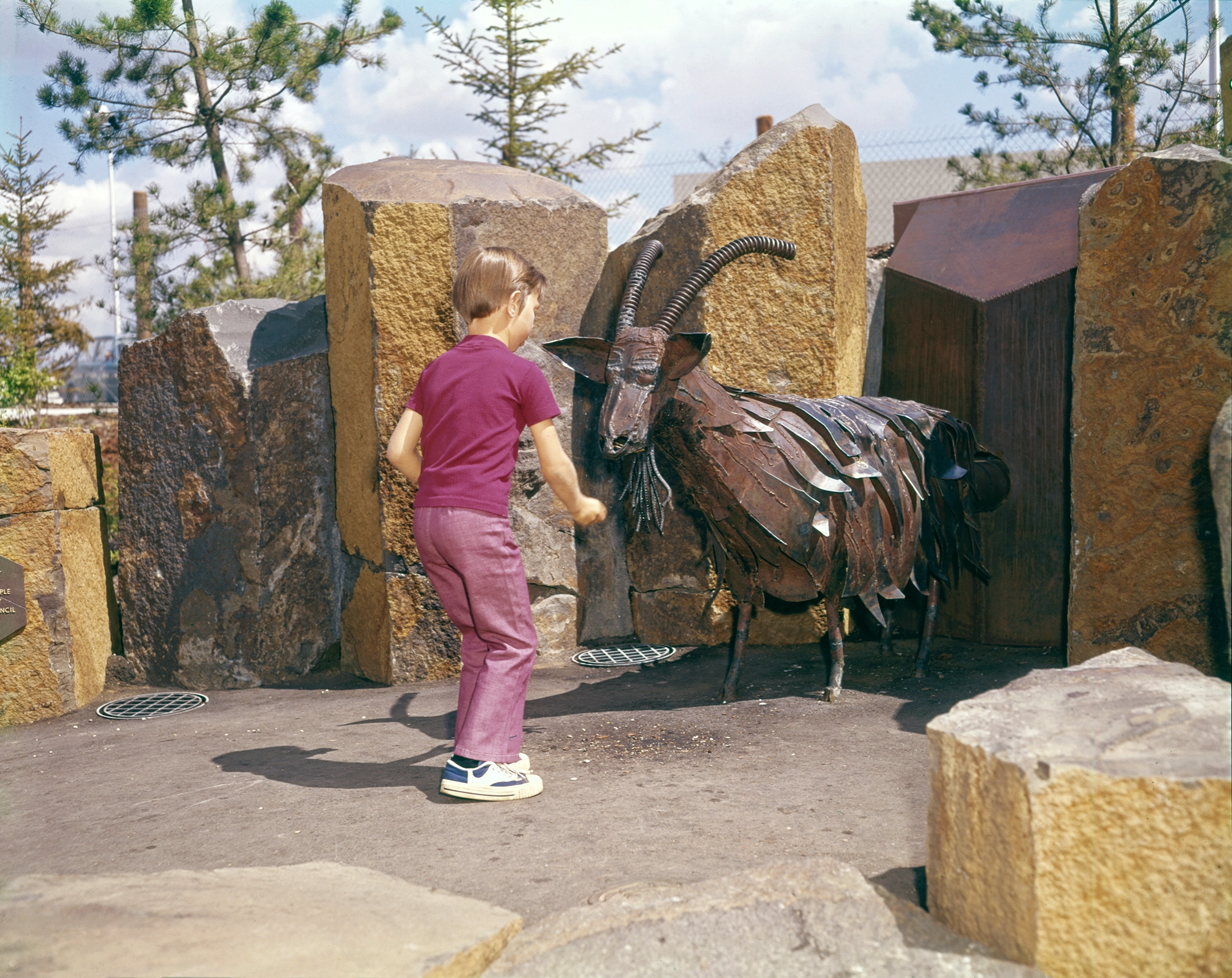 A child playing with the Garbarge Goat during Expo '74