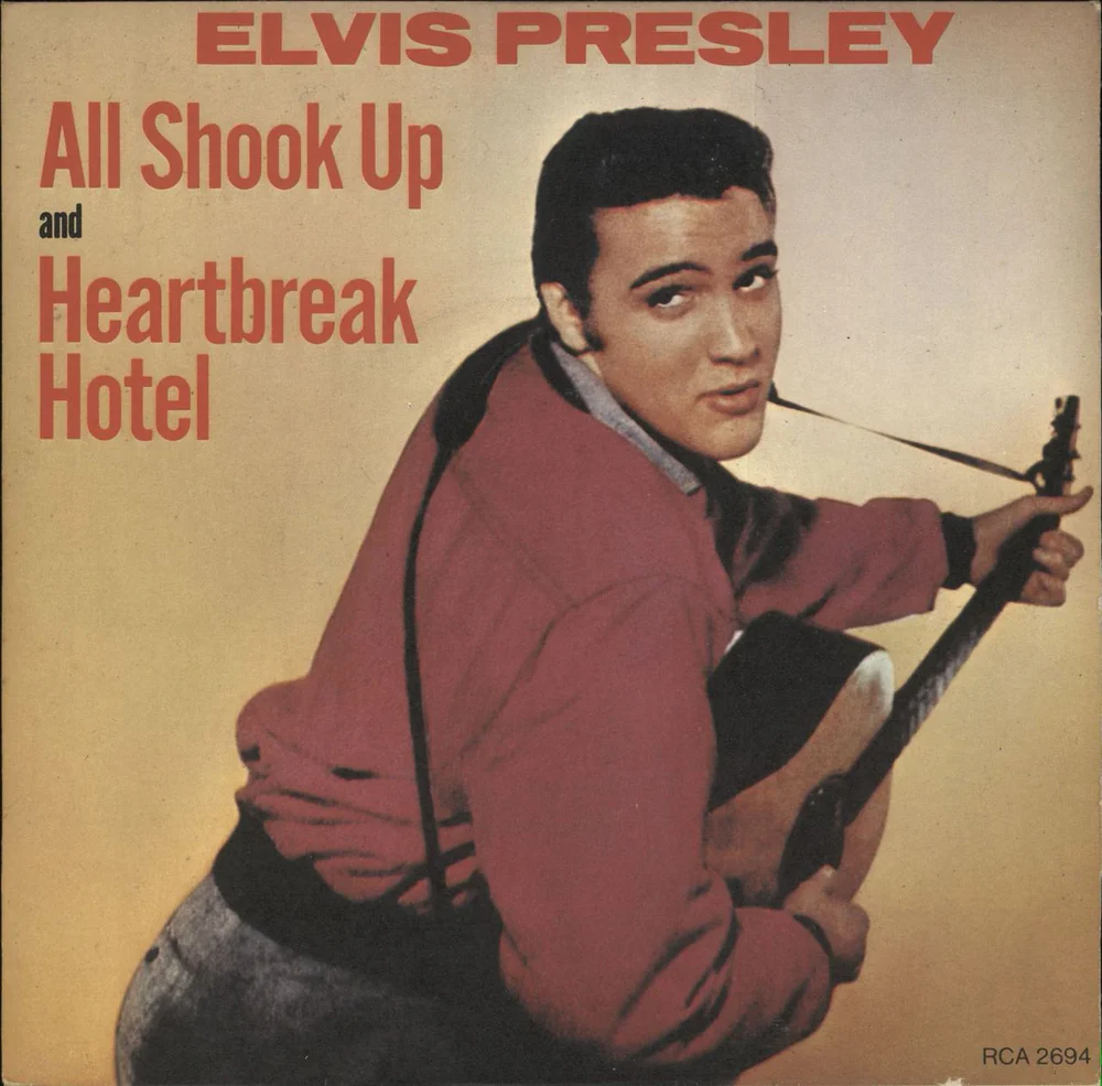 Another portrait of Elvis Presley for the album cover of All Shook Up, with the man on light-yellow background.
