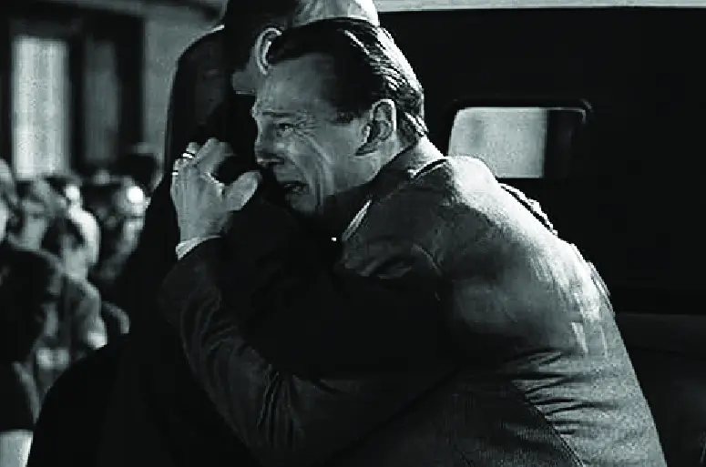 Oskar Shindler in Shindler's List crying as he says goodbye.