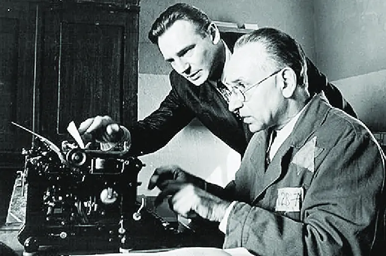 A still from Schindler's List of Schindler and his assistant working in his office.
